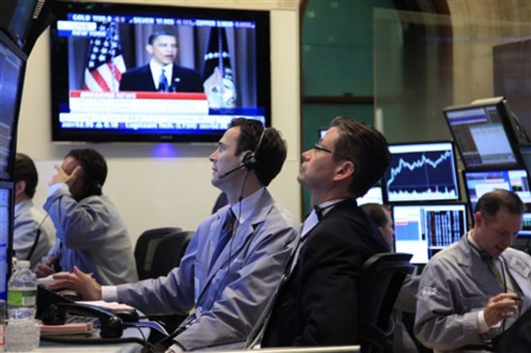 Traders work at the New York Stock Exchange during President Obama's speech Thursday.